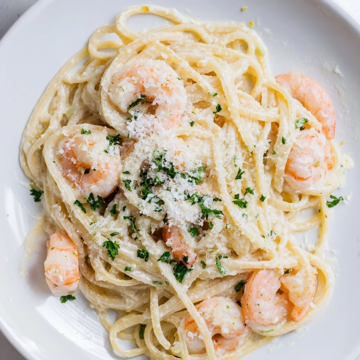Golden shrimp and linguine swimming in rich white wine garlic cream sauce