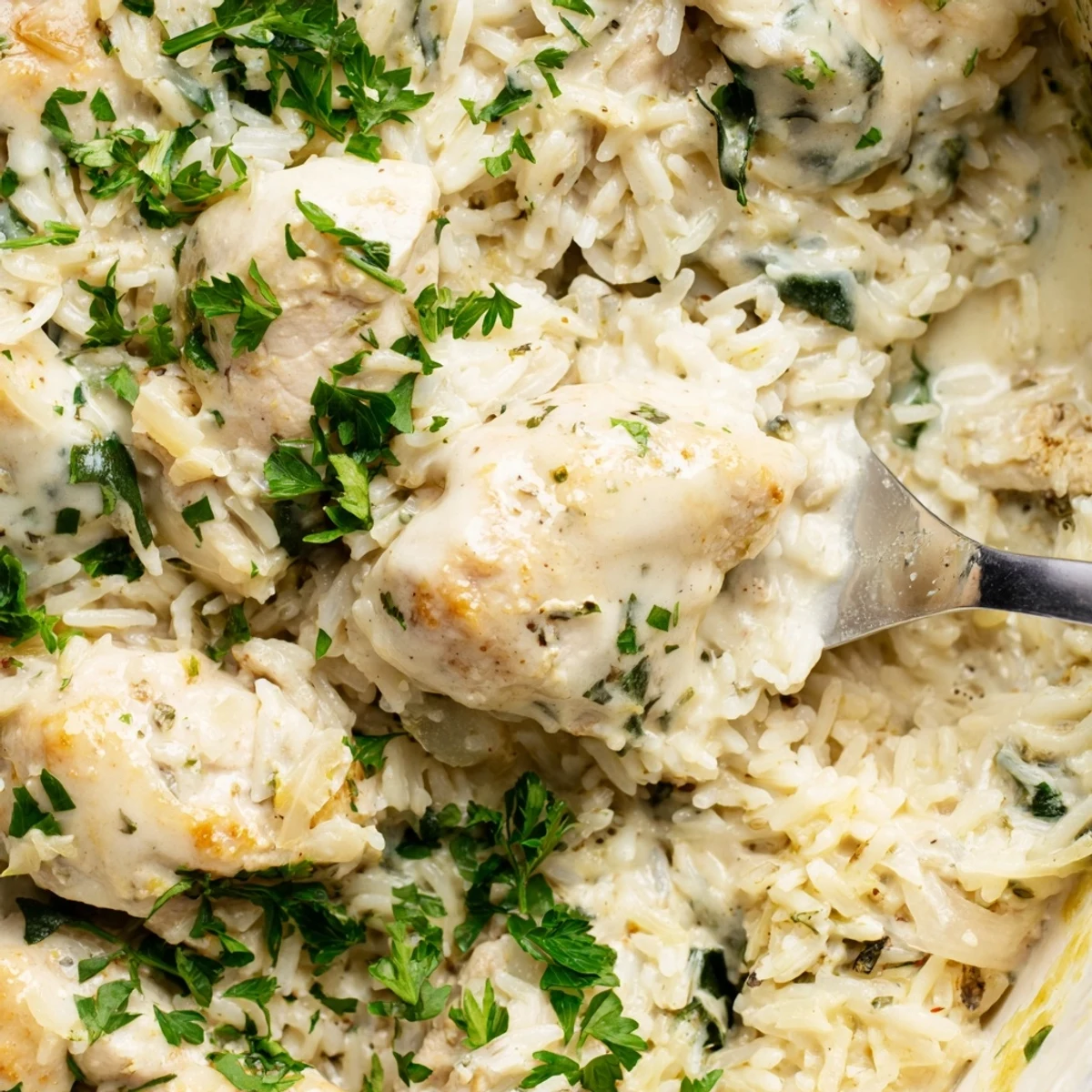 Golden one pot angel chicken rice bake with creamy sauce and tender baked chicken breasts