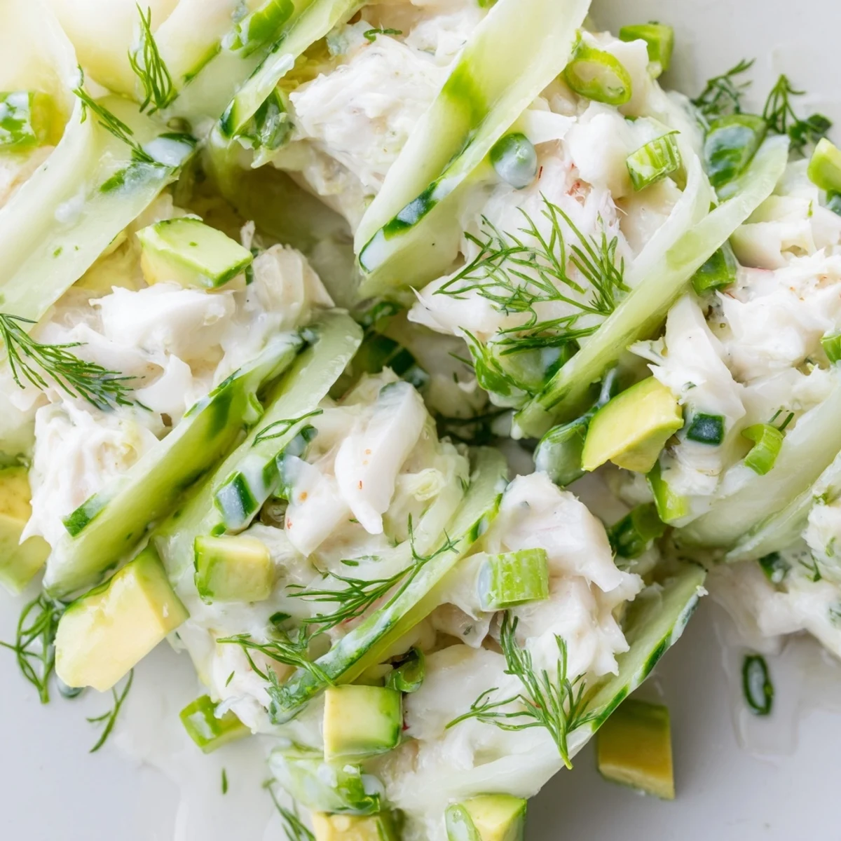 Chilled cucumber salad with crab meat featuring crisp slices and tender sweet seafood