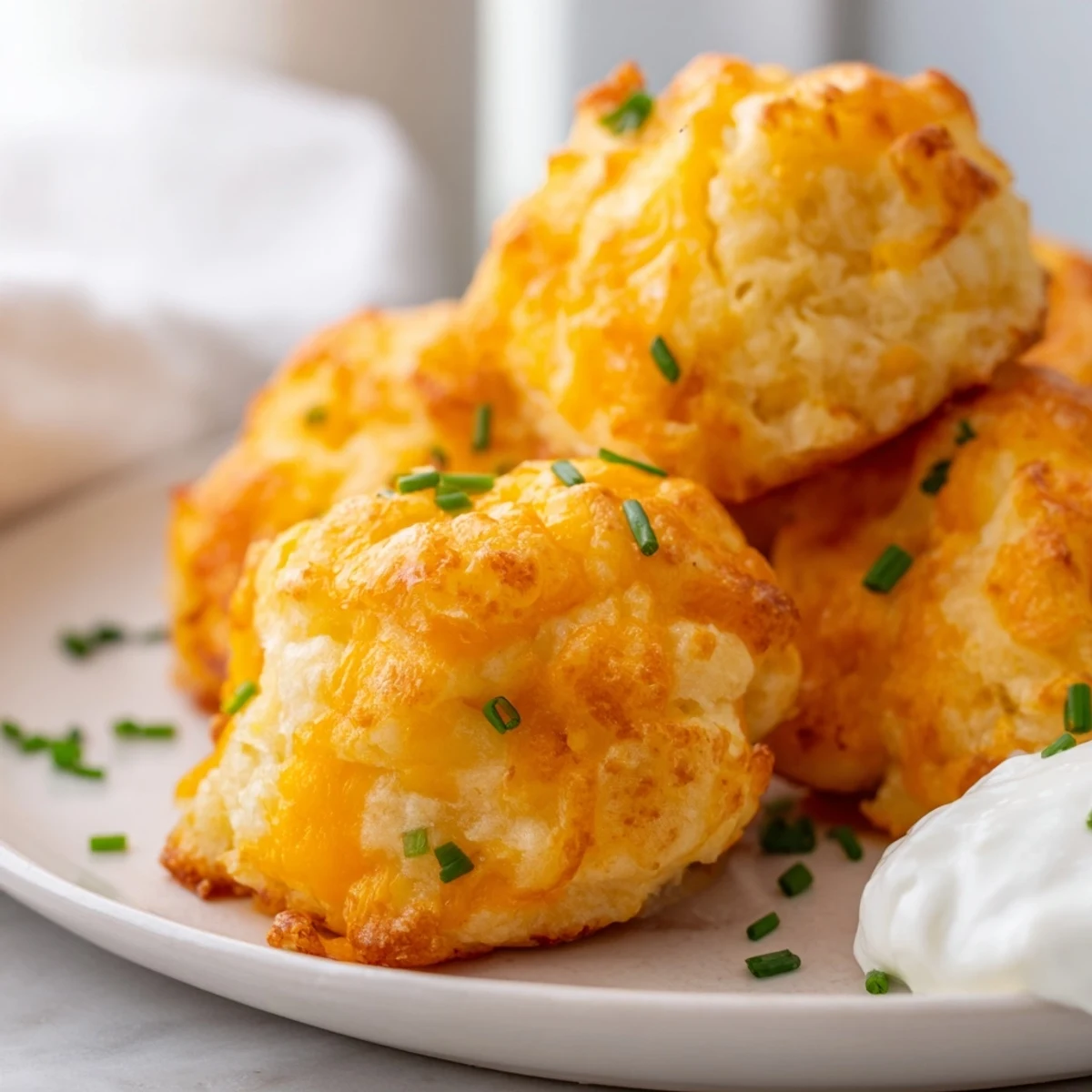Crispy Mashed Potato Cheese Puffs with melted cheddar and fresh green chives