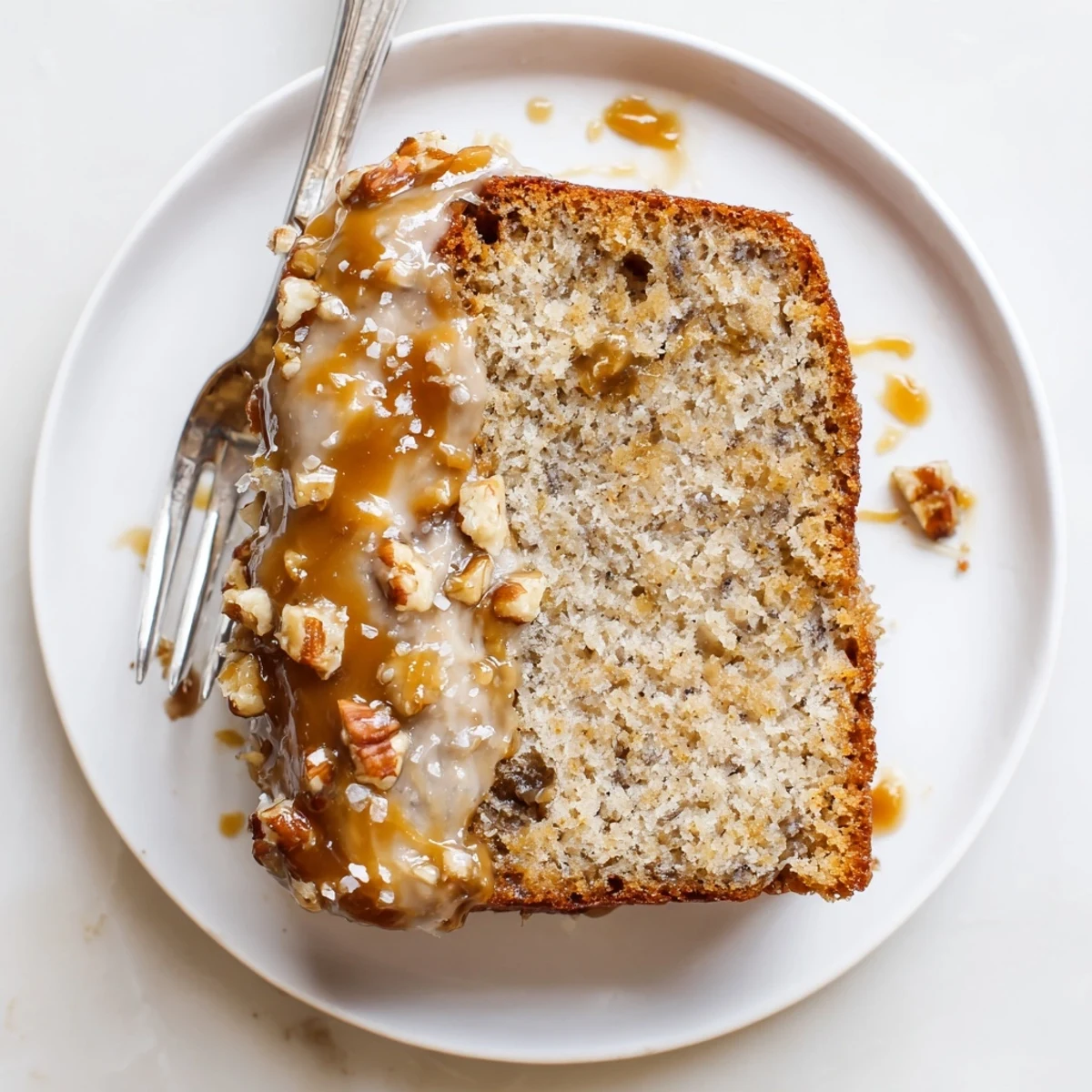 Sliced Salted Caramel Brown Butter Banana Cake Recipe, moist crumb and glossy caramel drizzle