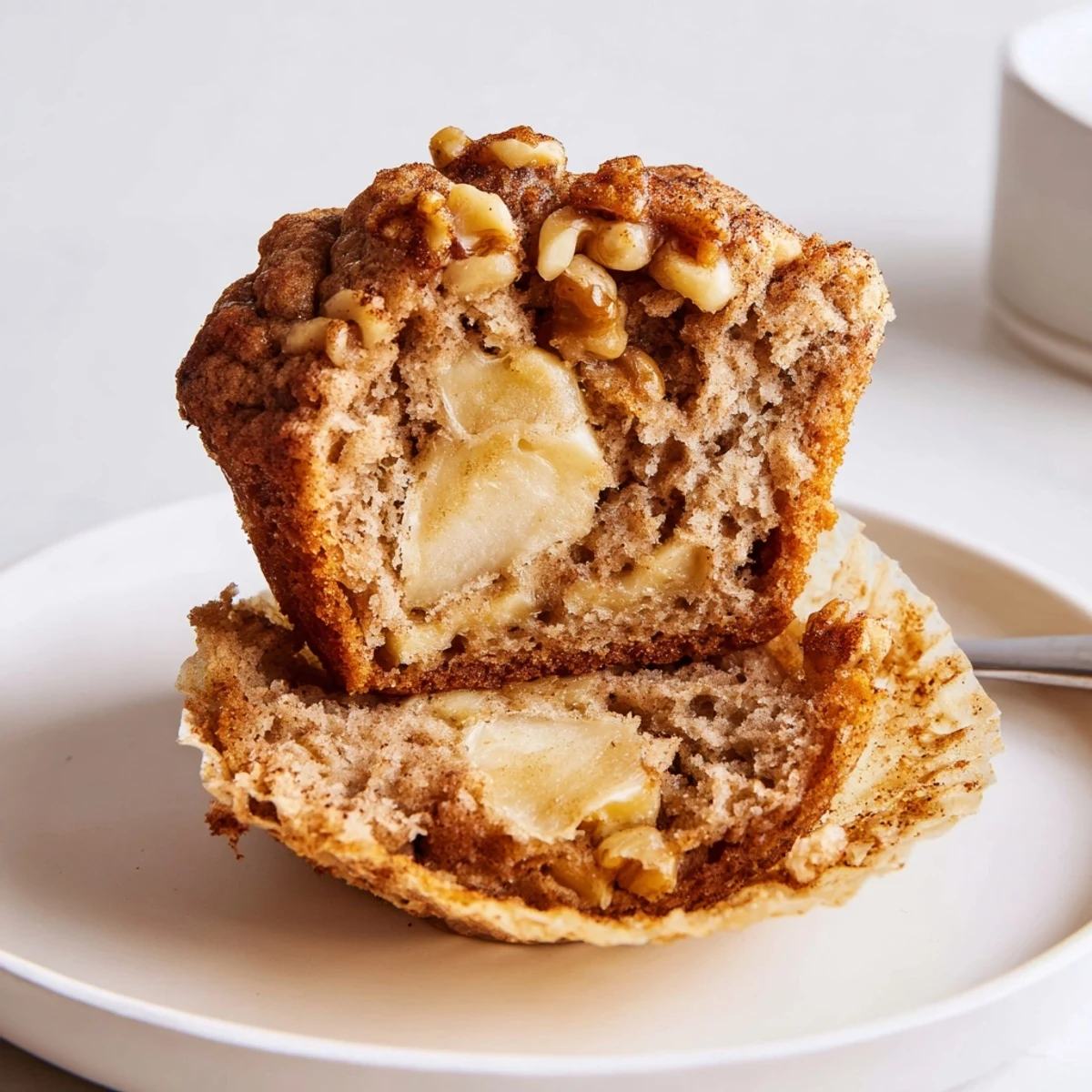 Fresh-baked Healthy Apple Cinnamon Greek Yogurt Muffins studded with tender apple pieces.