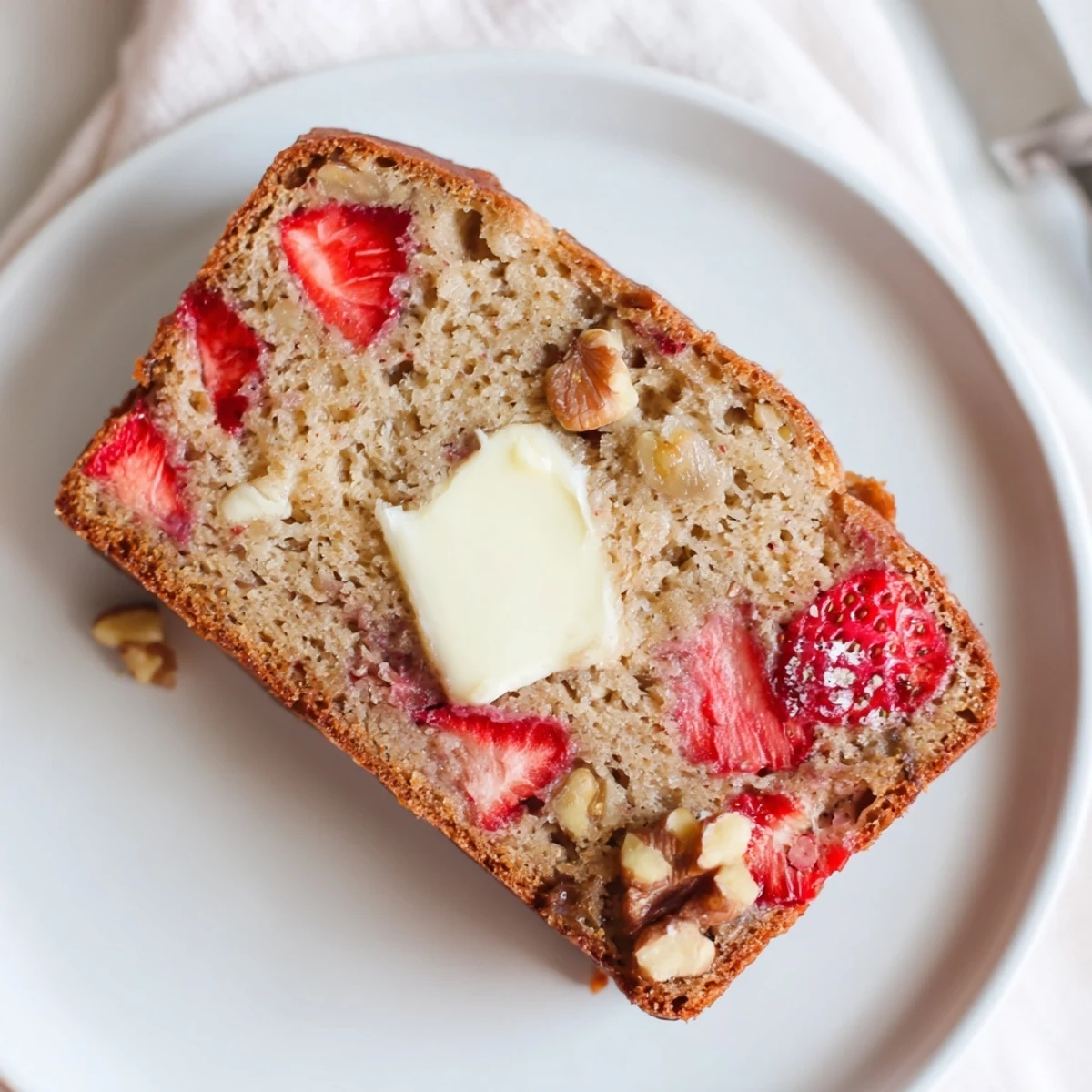 Strawberry Banana Bread Recipe: warm sliced loaf with juicy berries and banana aroma