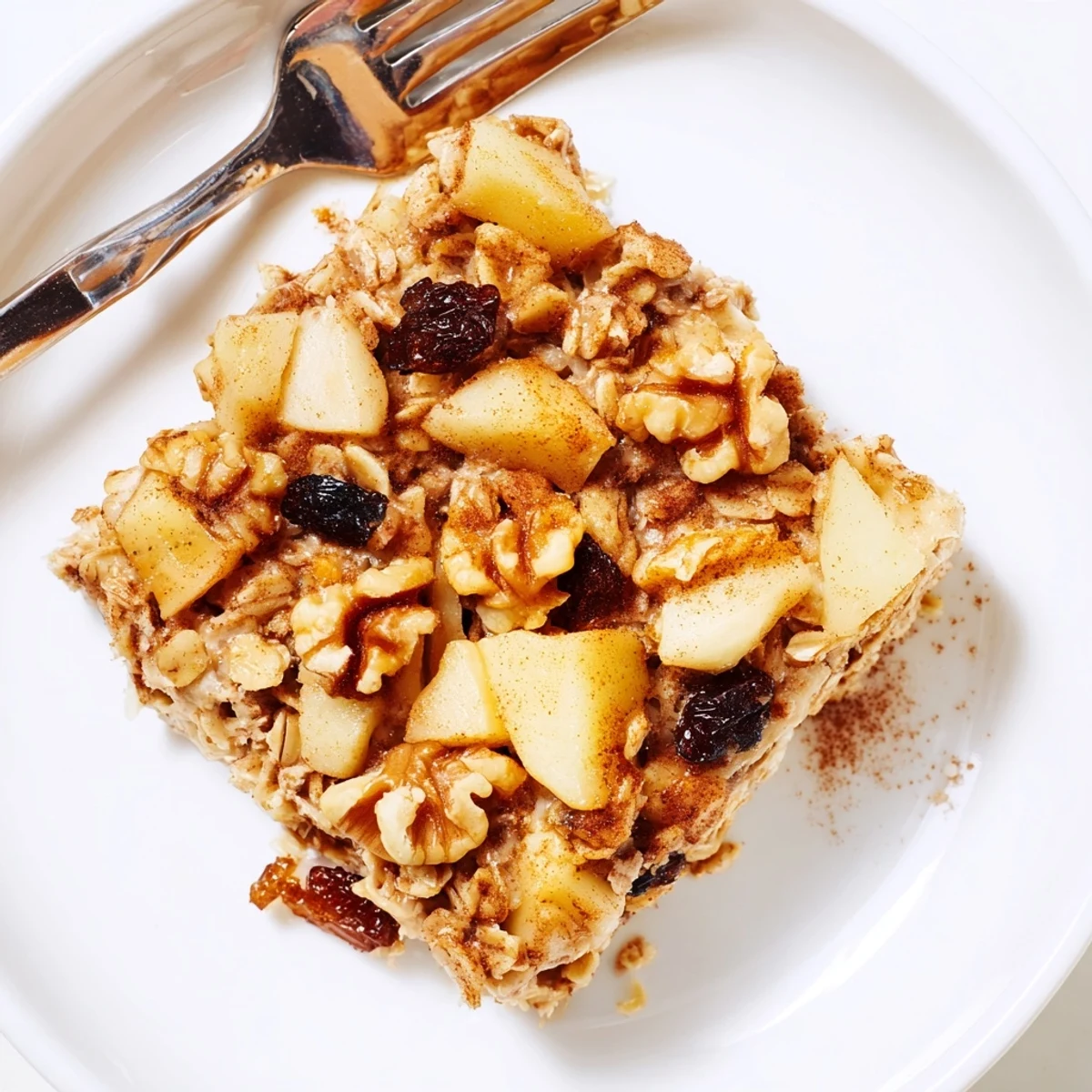 Delicious Apple Cinnamon Oatmeal Bake Recipe For Mornings warm, golden, spiced, served with yogurt