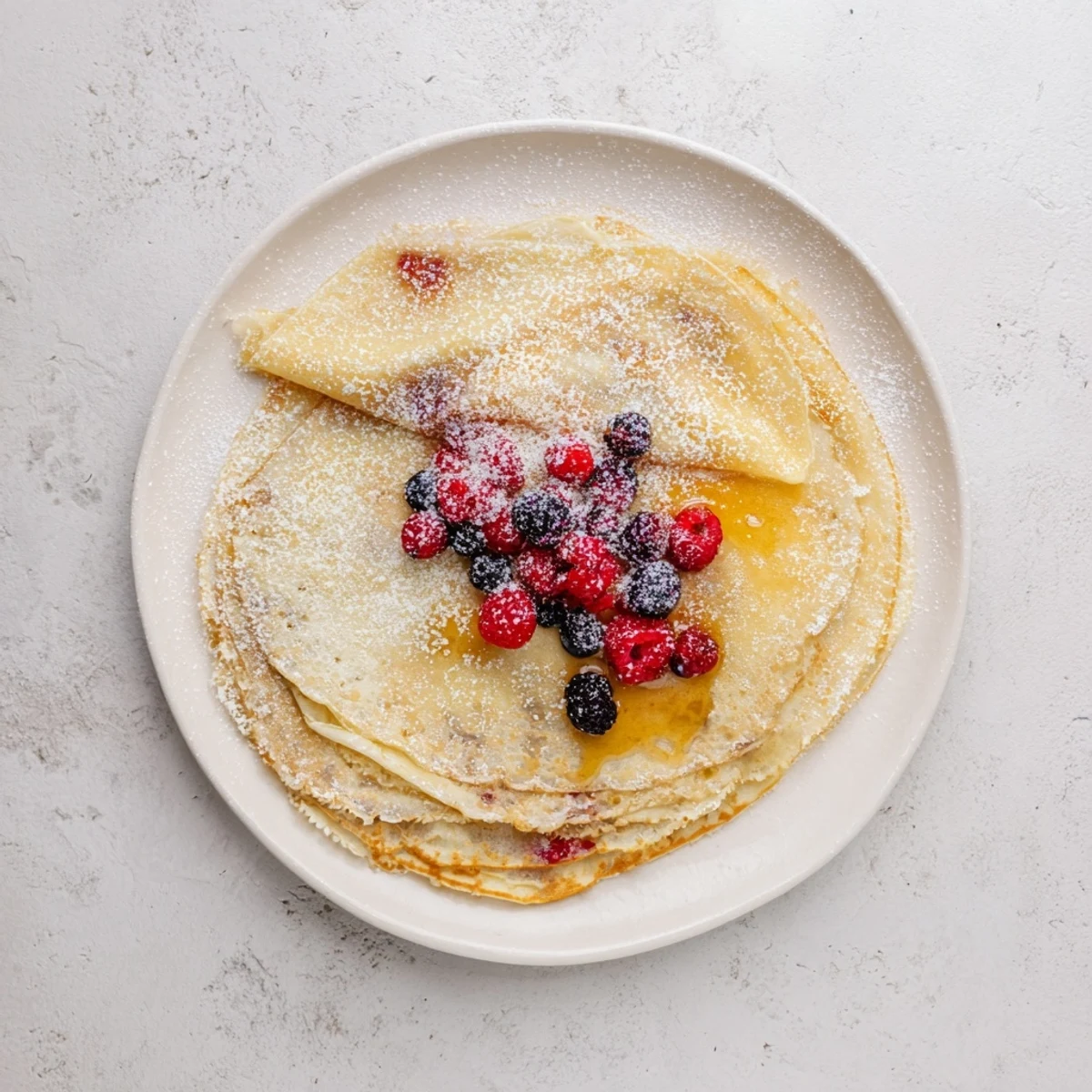 Warm thin crepes drizzled with luscious honey for a sweet breakfast treat